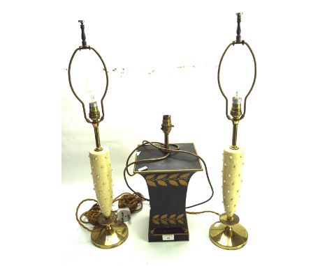 A pair of contemporary lamp bases and one other. The pair mounted on circular brass bases, H43cm (excluding the fitting), the