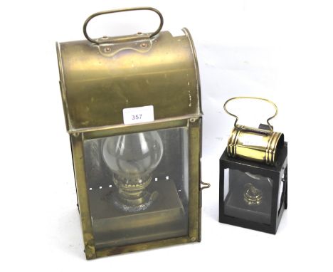 A Sherwoods hand held brass carriage lantern and a similar 19th century lantern. H31.5cm