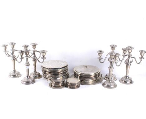 An assortment of silver plated wares. To include Ianthe candelabra, candlesticks and various coasters