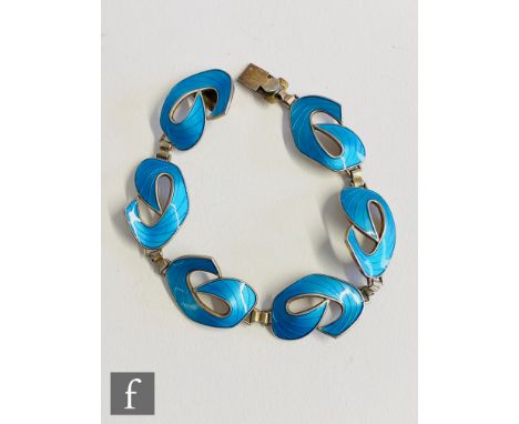 A Norwegian silver bracelet comprising six blue enamelled stylised scroll panels terminating in tongue and box fastener, leng