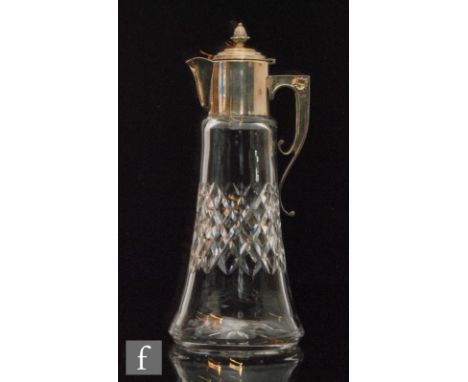 An early 20th Century Stourbridge glass claret jug, with diamond cut tapering cylindrical body with silver plated mount with 