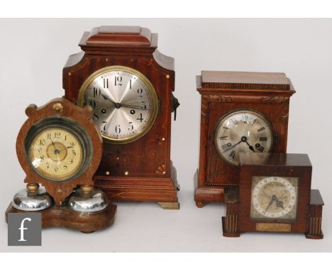 An Edwardian inlaid mahogany mantle clock with Arabic silvered dial on bracket feet, a Rotherham 1950s walnut cased mantle cl