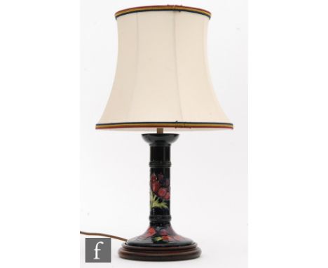 A Moorcroft table lamp of candlestick form decorated in the Anemone pattern, marks obscured by affixed base, height 23cm excl