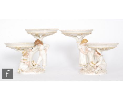 A pair of Royal Worcester figural two tiered comports modelled by James Hadley in the style of Kate Greenaway, circa 1860s, t