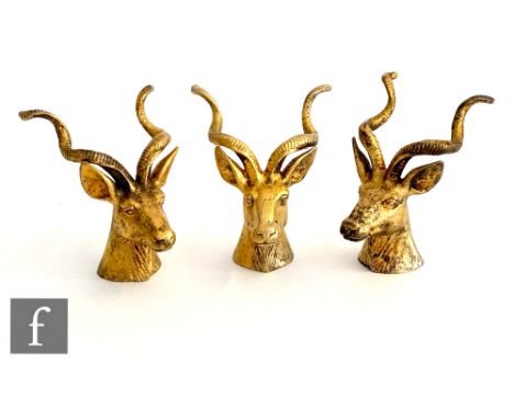 Three hallmarked silver gilt studies of Spiral-horned Antelope heads, possibly knife rests, each 7cm high, London 1985 Asprey
