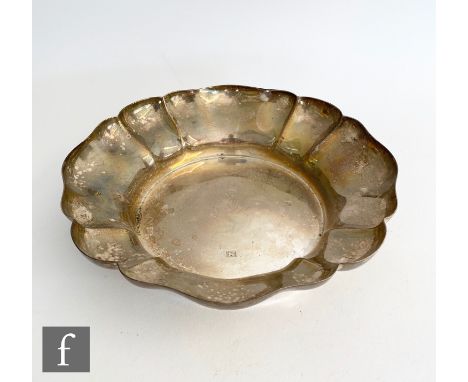 A hallmarked silver shallow bowl modelled as a flower head, diameter 24cm, weight 15oz, Birmingham 1964, Perry Greaves Ltd. 