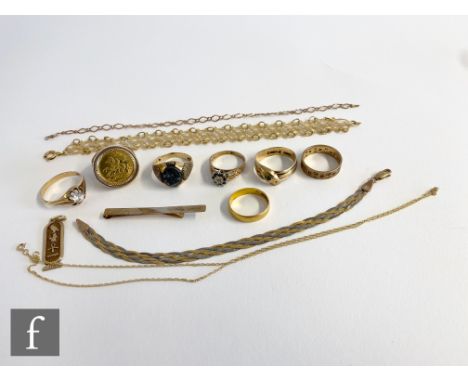 A parcel lot of assorted 9ct items to include six assorted rings, bracelets, tie slide and chains, total weight 46.5g, with 2