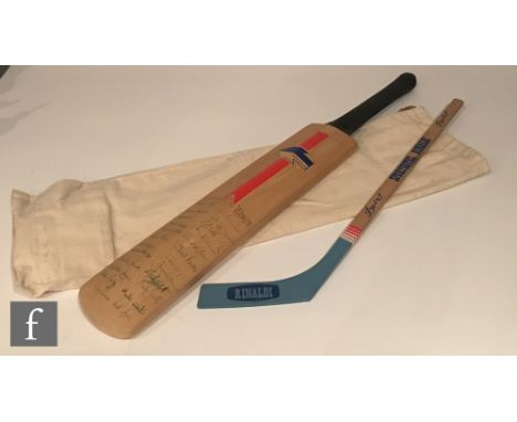 A cricket bat signed by the Kent team with original signatures John shepherd, Neil Taylor, Kevin Jarvis etc and a presentatio