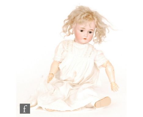 An early 20th Century doll by Simon and Halbig for Kammer and Reinhardt, bisque socket head in dolly face mould with sleeping