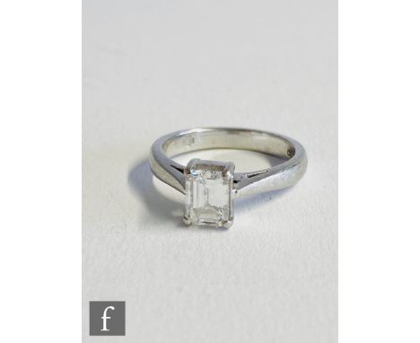 A platinum diamond solitaire ring, rectangular step cut claw set stone, 0.77ct, colour D, clarity IF (internally flawless) to