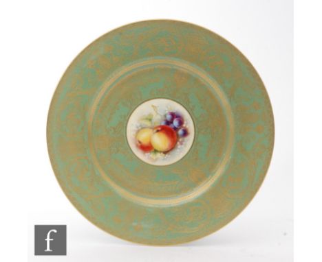 A Royal Worcester cabinet plate decorated by Christopher Hughes with a small Fallen Fruits roundel with apples and grapes wit