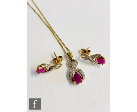 A modern 9ct hallmarked ruby and diamond pendant and earring set, pendant suspended from a 9ct trace chain. 