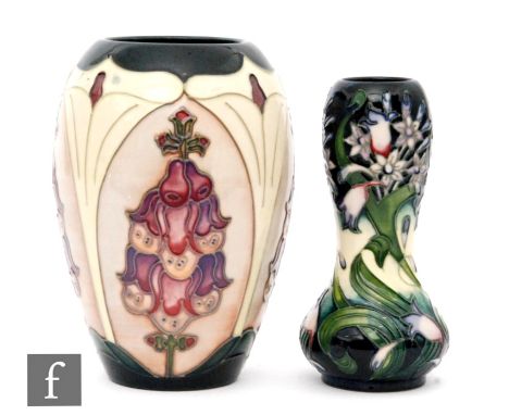 A Moorcroft Pottery vase decorated in the Foxglove pattern designed by Rachel Bishop, height 18cm together with a Moorcroft P