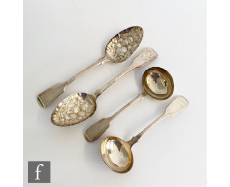 A pair of hallmarked silver fiddle pattern sauce ladles with a pair of table spoons with later berry decoration, total weight
