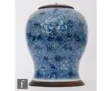 A Chinese Kangxi (1654-1722) period vase, of baluster form, the body decorated with a series of lotus flowers and meandering 