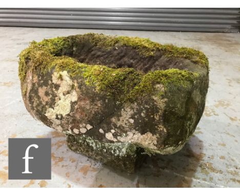 A small sandstone pump trough of rectangular form, raised to a later base section, height excluding the base 22cm (35cm inclu