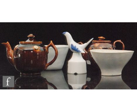 Two Victorian jelly or pate moulds, each in white with moulded designs together with two tea for one Barge Ware teapots and a