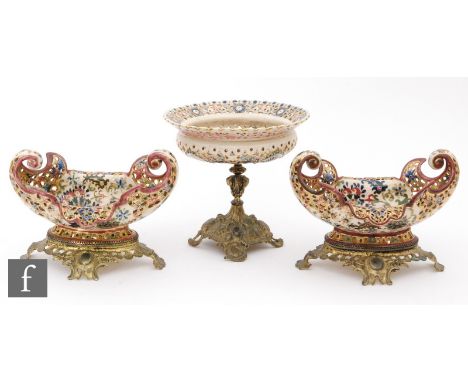 A pair of late 19th Century Fischers, Budapest oval bowls with curled edges with Persian type decoration, both raised to gilt