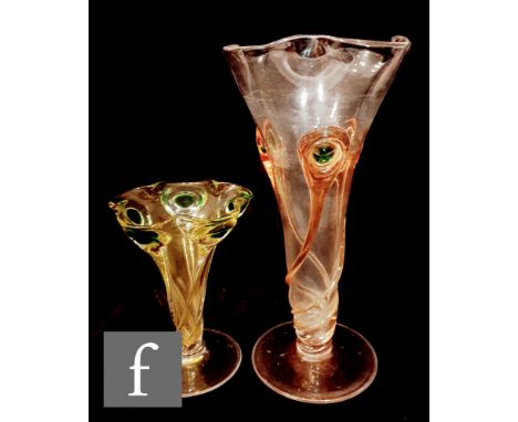 Two early 20th Century Stuart and Sons glass vases, each of footed flared form with petal rim, the first clear with applied p