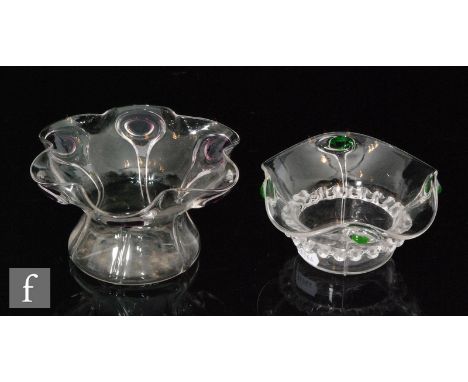 Two early 20th Century Stuart and Sons posy bowls, the first of circular form with wide crimped rim, with applied peacock tra