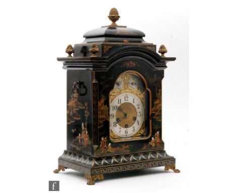 An early 20th Century Chinoiserie black lacquered bracket clock by John Bennett London, the arched dial incorporating two sub