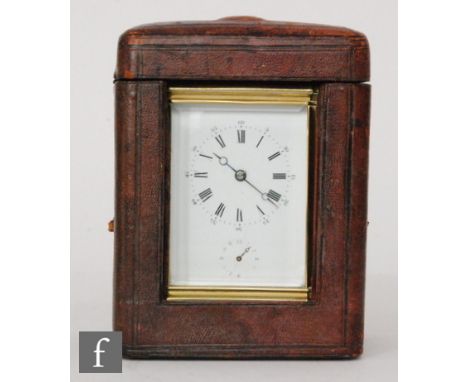 A 19th Century eight strike/alarm brass carriage clock with Roman and Arabic numerals to a white enamelled dial, striking on 
