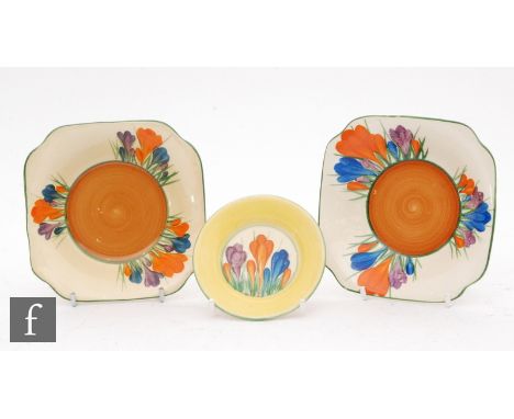 A Clarice Cliff small pin dish decorated in the Crocus pattern, printed script Wilkinson mark, diameter 8.5cm together with t