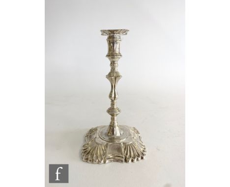 A late Victorian taper stick, canted square base with part fluted decoration below knop column and square sconce, height 14cm