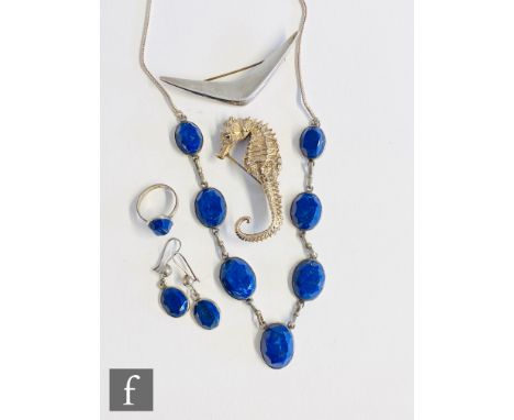 Two Danish silver brooches, one modelled as a sea horse, the other as a chevron, both stamped to reverse, with a lapis lazuli