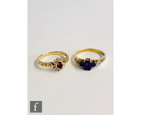 A 9ct hallmarked ruby and diamond cluster ring, with  a similar amethyst and diamond five stones example, total weight 4.8g. 