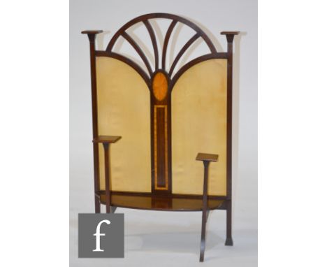 An Art Nouveau mahogany firescreen, with inlaid paterae, satin lined panels and square platform capitals. 