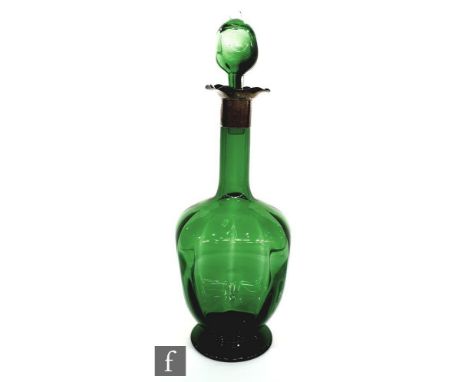 A late 19th Century Stevens and Williams green glass decanter of footed dimpled ovoid form with hallmarked silver collar, wit