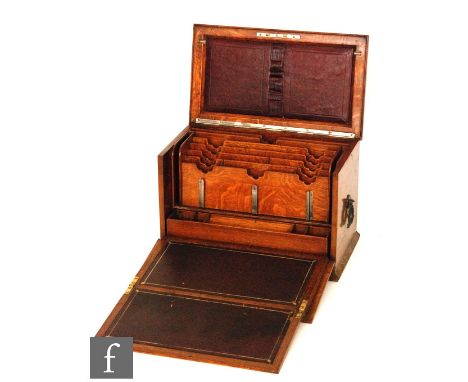 A late 19th Century light oak stationery cabinet with fitted stepped interior and ink compartment and fall front slope, width