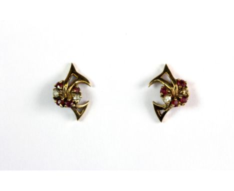 A pair of 9ct yellow gold diamond and ruby set stud earrings.