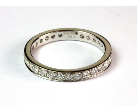 An 18ct white gold diamond set full eternity ring together with E. D. R. ring report (M).