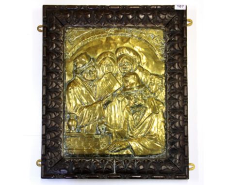 A 1920's oak framed hammered brass panel, 50 x 63cm.