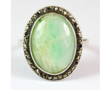 A 1930's silver and marcasite jade set ring (some marcasite missing) (M.5).