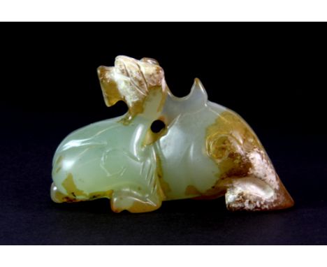 A Chinese carved archaic form jade figure of a dragon, 7 x 4 x 2.5cm.