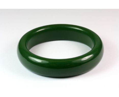 A nephrite jade/hardstone bangle, Dia. 8.2cm.