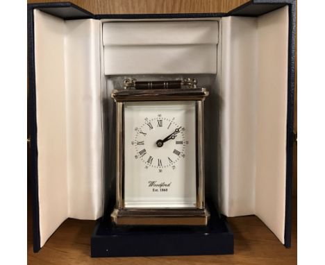 A boxed silver plated carriage clock.