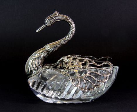 A Continental hallmarked silver mounted glass swan trinket box, the wings open out, bearing import marks, L. 13cm.