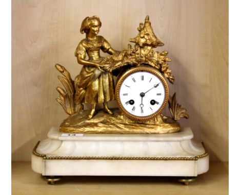 A 19th century French marble and ormolu mantle clock with a enamel dial, raised on bun feet, impressed VM on the movement, H.