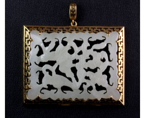A stunning 18ct yellow gold (stamped 18ct) mounted pendant set with intricately carved mutton fat jade, 4.7 x 3.7cm.