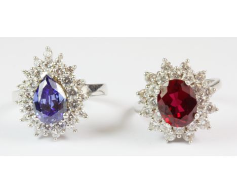 A 925 silver tanzanite and white stones cluster ring (N.5) together with a 925 silver ruby and stone set cluster ring (M.5).