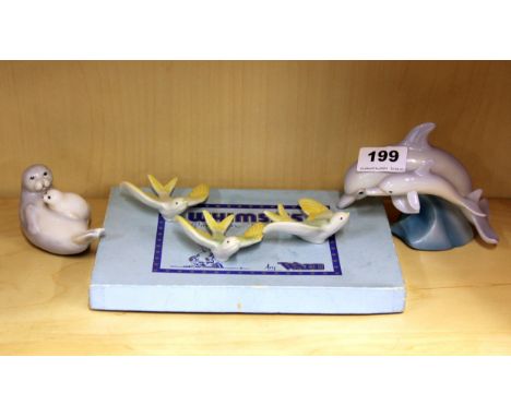 Two Royal Worcester animal figures with three porcelain birds and a boxed set of five Wade Whimsies.
