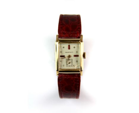 A lady's Tiffany & Co manual wind dress watch with red leather strap.