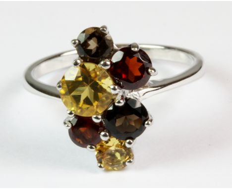 A 925 silver ring set with smokey quartz, garnets and citrines (R.5).