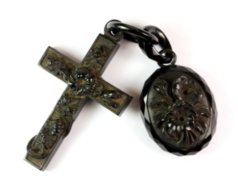 A Victorian jet cross and a jet portrait pendant.