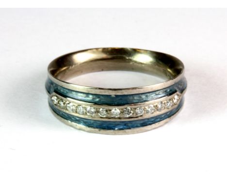 An unusual 18ct white gold and enamel diamond set half eternity ring (N).
