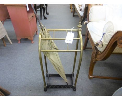 An antique brass & cast iron stick/umbrella stand plus umbrella (2).